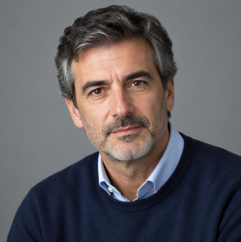 Studio portrait of a Portuguese male editor in his late 40s